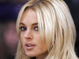  FILE  Actress Lindsay Lohan is seen at the Los Angeles Lakers game against the Orlando Magic in their NBA basketball game, in this Dec. 2, 2007, file photo in Los Angeles. Court papers filed Tuesday, Dec. 4, 2007, allege the busboy who sued Lindsay Lohan has proof the actress had been drinking before she collided with his van in October 2005. Raymundo Ortega contends that Lohan drove her Mercedes-Benz into a van he was driving after she drank alcohol and later tried to escape paparazzi. He is seeking 200,000 in damages.  AP PhotoMark J. Terrill, file